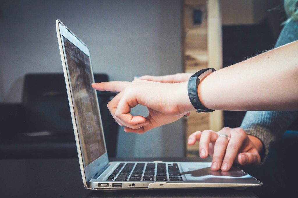 Person using a laptop for a calm digital client experience