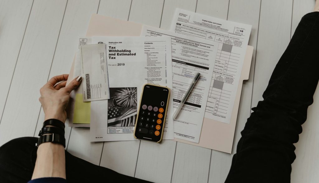 Desk with planner and documents used for budgeting care costs