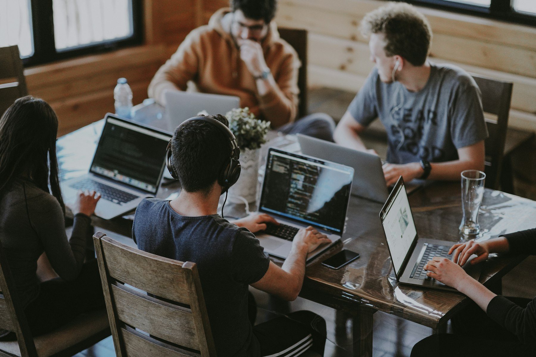 Professionals collaborating on digital strategy in a bright modern workspace